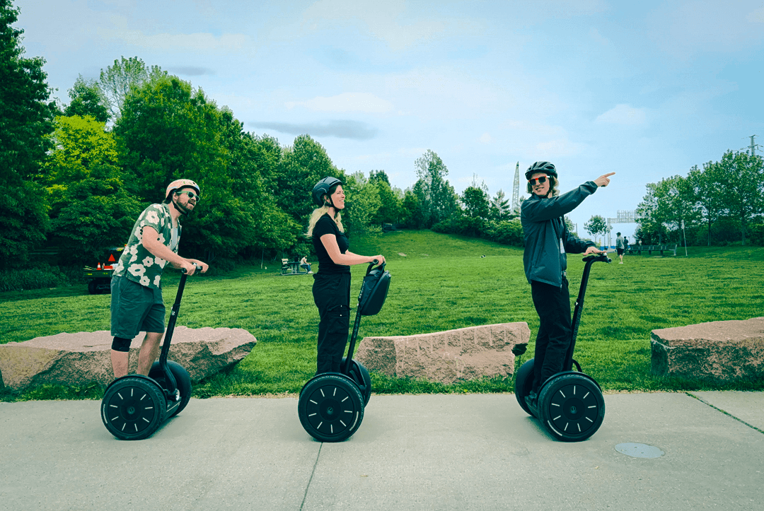 Segway tour group enjoying green parkland and open spaces during Canary District outdoor adventure tour in Toronto