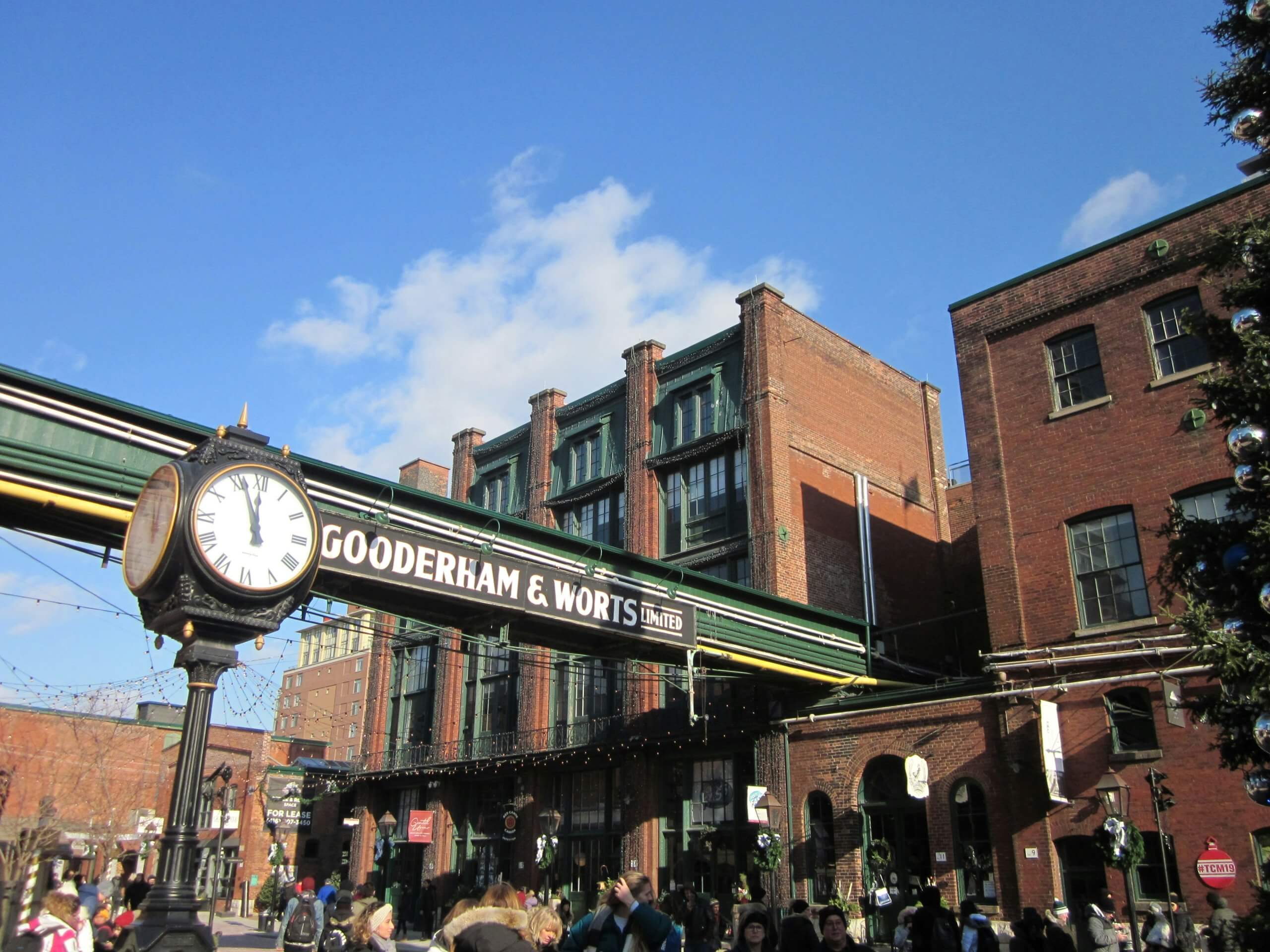 A guide leading a student group through the Distillery District